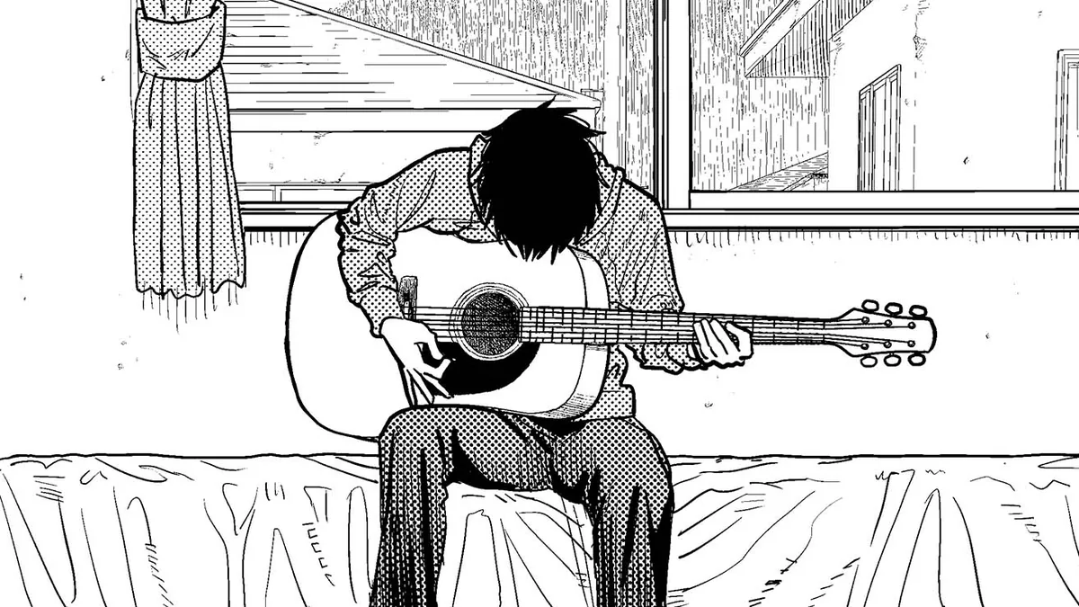 Cowok itu memainkan gitar di kamarnya